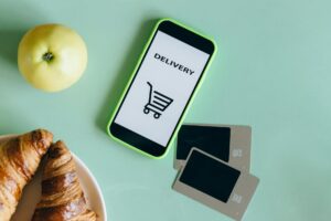 Person using smartphone to browse social media commerce features and shopping tools