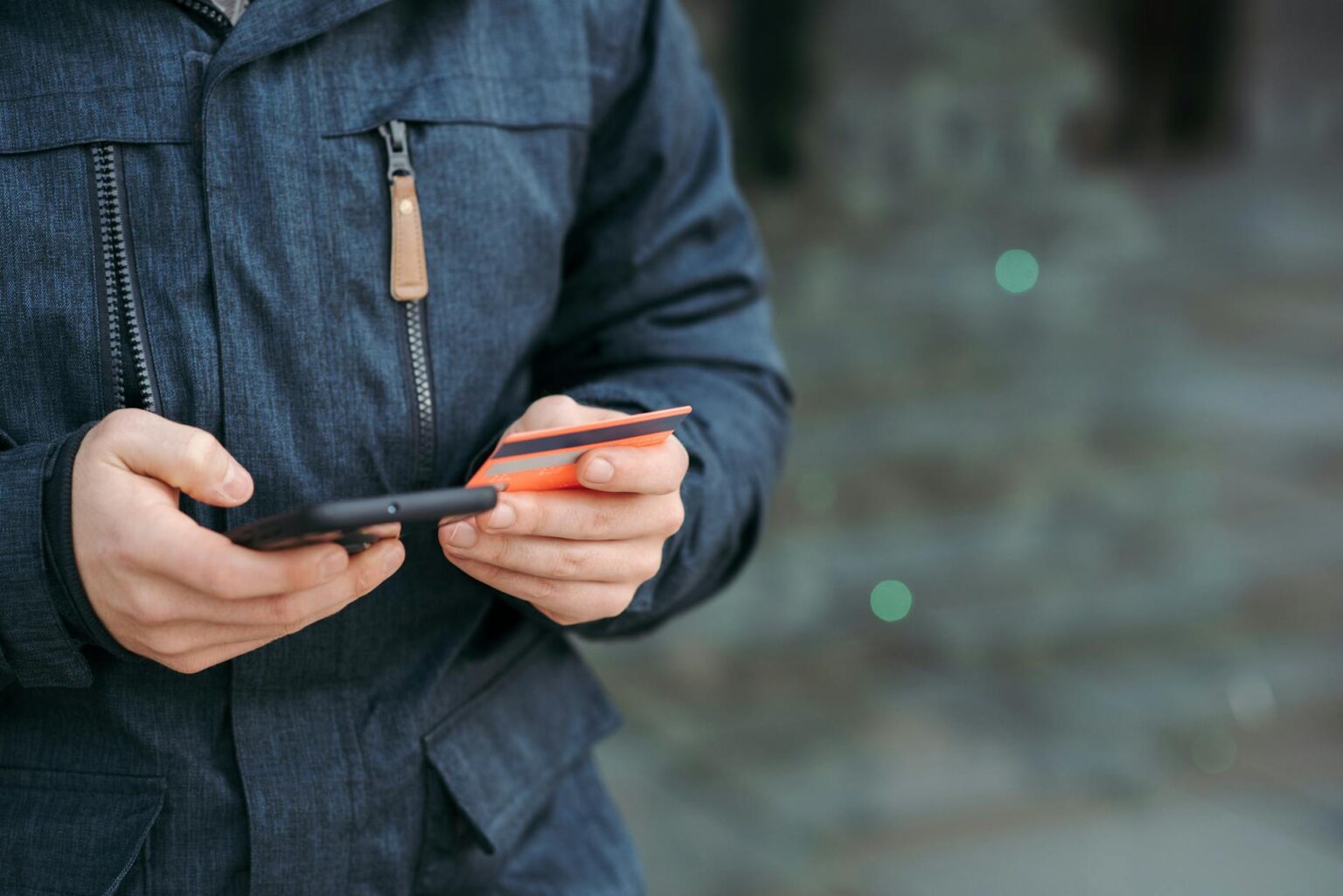 Person using smartphone to make a mobile payment transaction