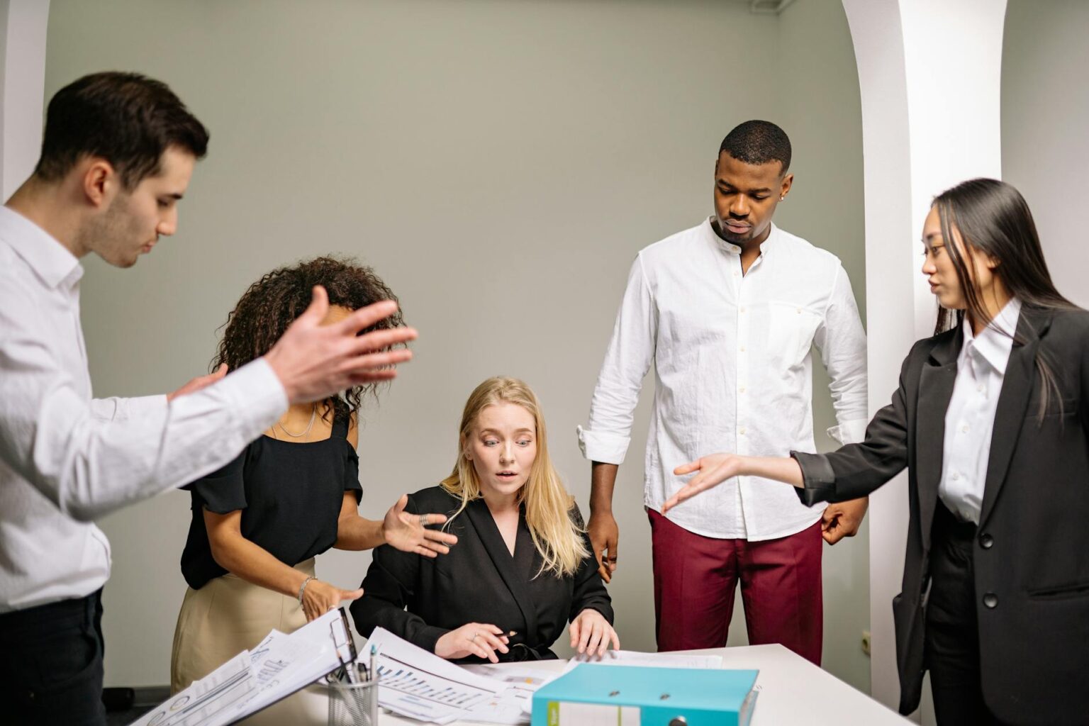 Professional business meeting with diverse employees discussing workplace policies
