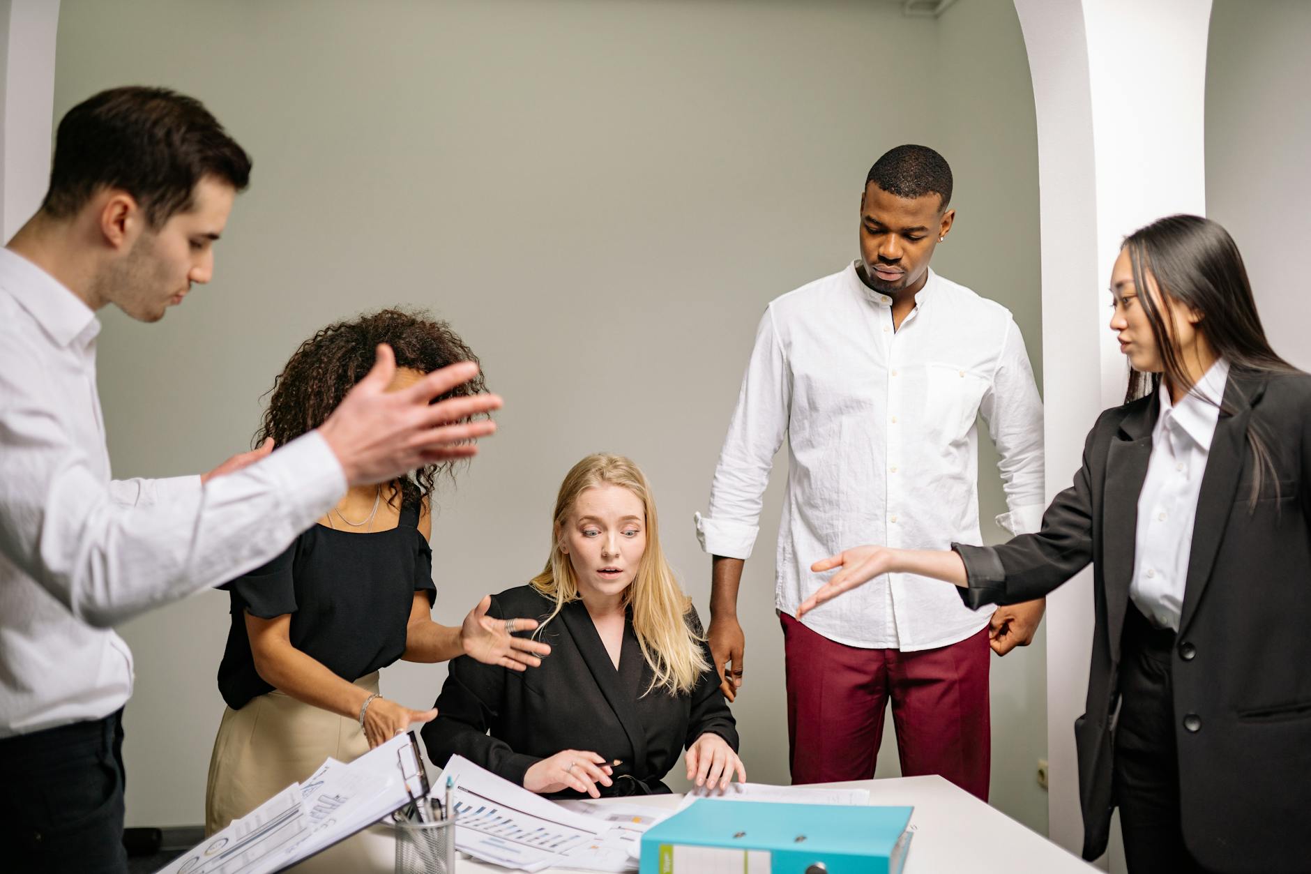 Professional business meeting with diverse employees discussing workplace policies