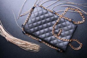 Collection of luxury designer handbags displayed in retail setting
