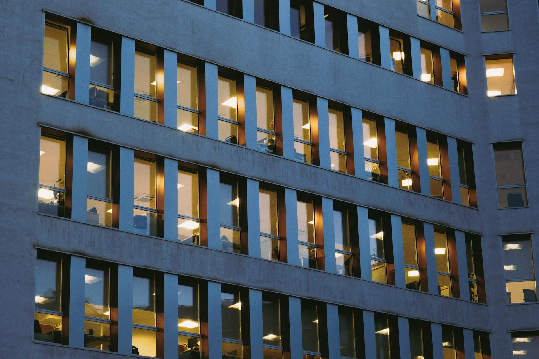 Empty modern office building interior showing the impact of remote work on commercial real estate