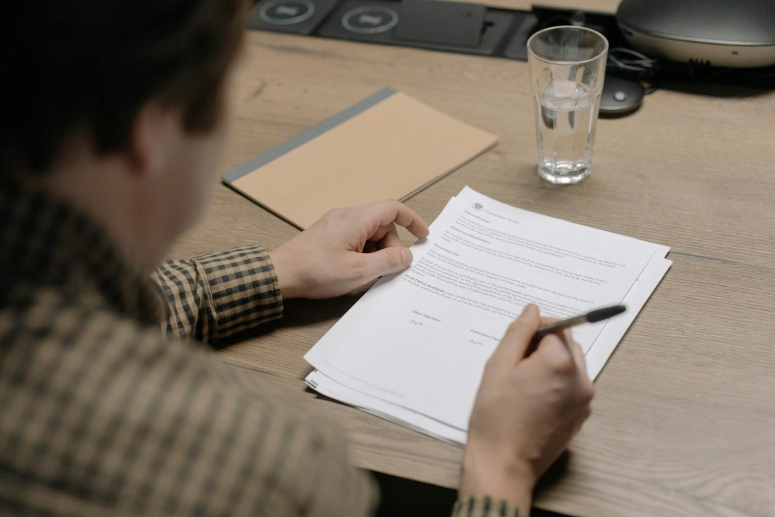 Financial documents and calculator showing retirement planning calculations on a desk