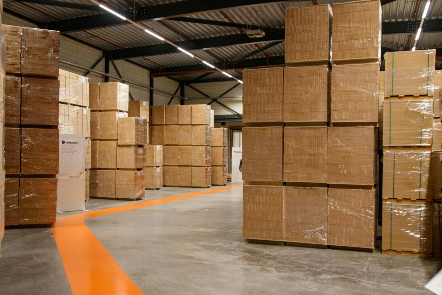 Modern warehouse with organized shipping boxes and inventory management systems