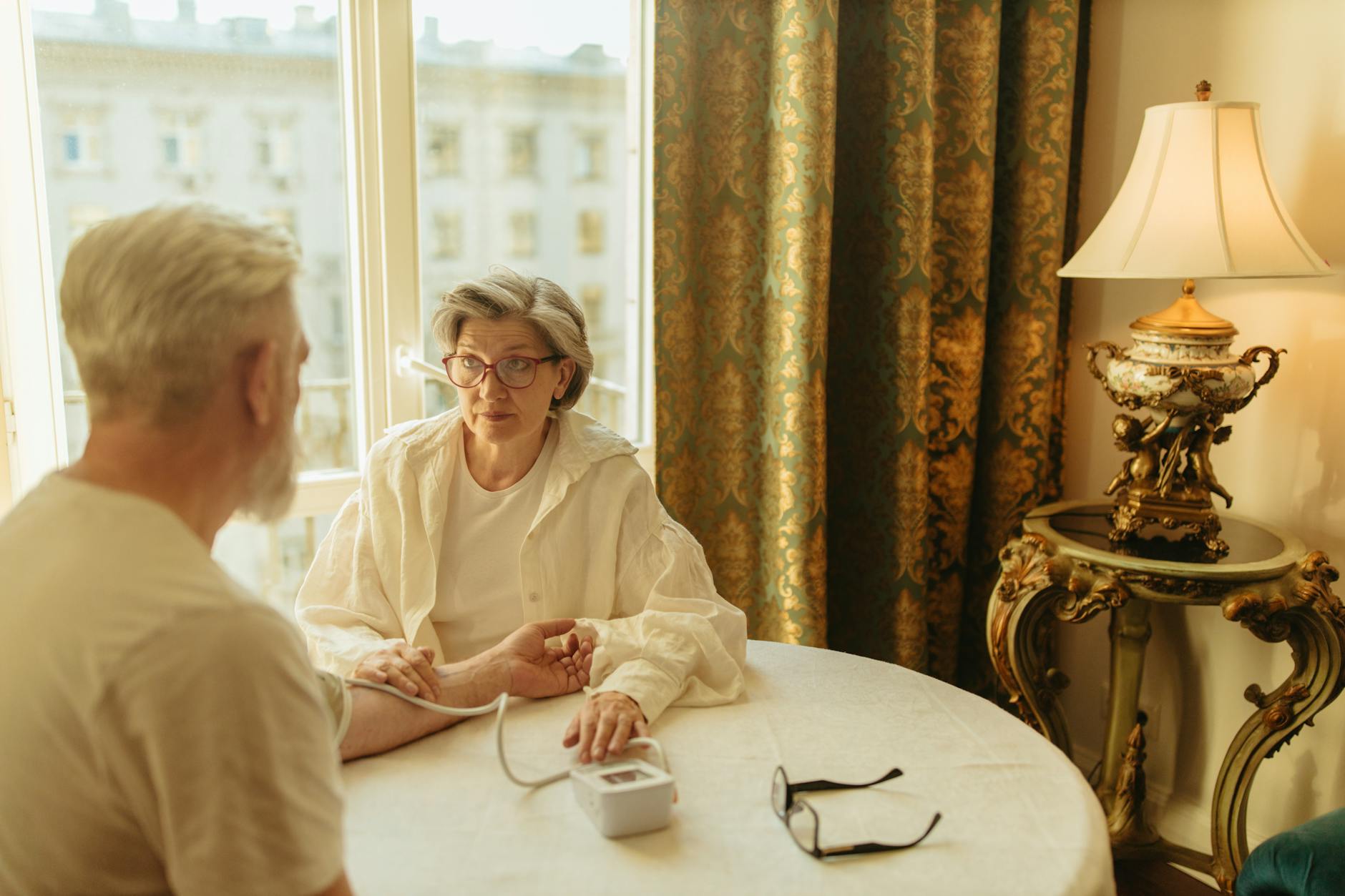 Elderly person receiving care at home from healthcare worker