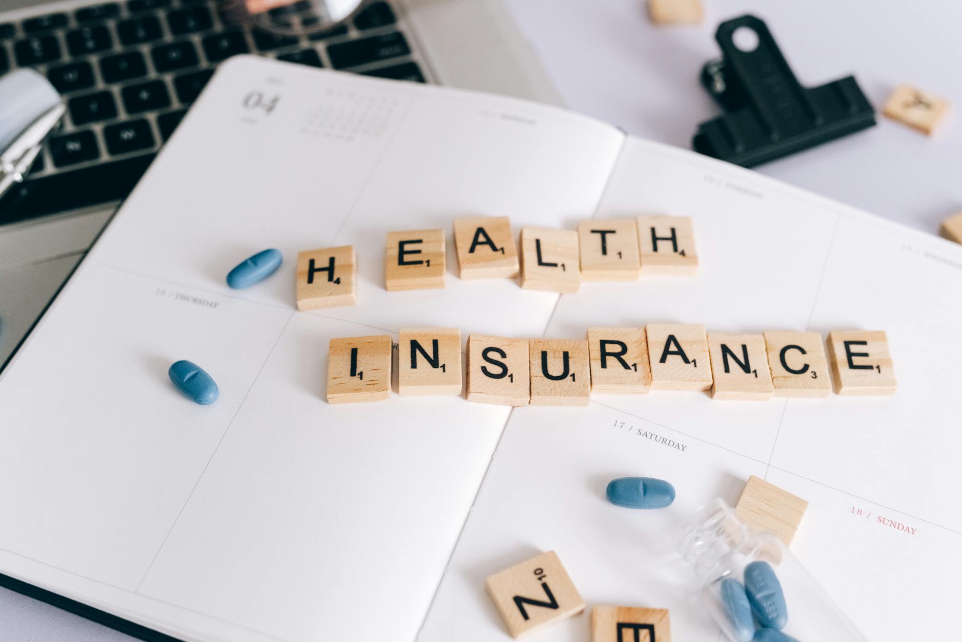 Person reviewing medical bills and insurance documents at desk