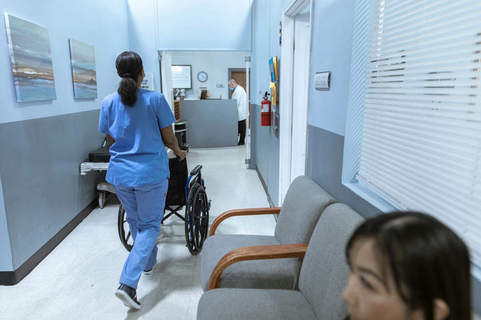 Clean hospital corridor with medical equipment and professional lighting