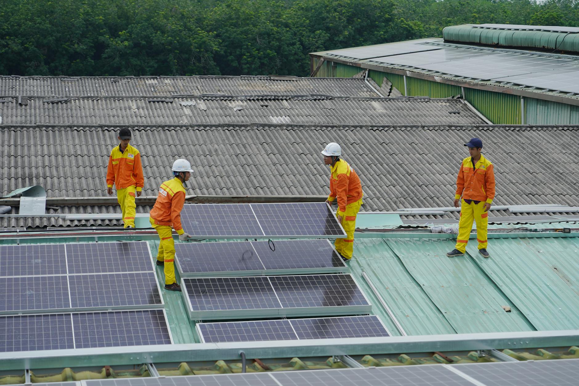 Industrial building with rooftop solar panels showing corporate on-site renewable energy generation