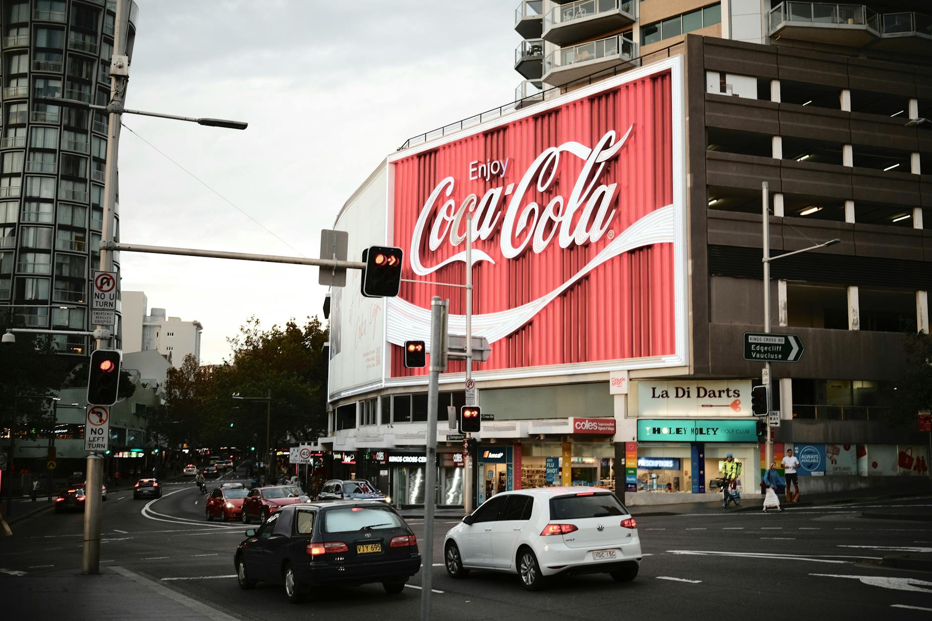 Digital advertising display showing multiple colorful advertisements