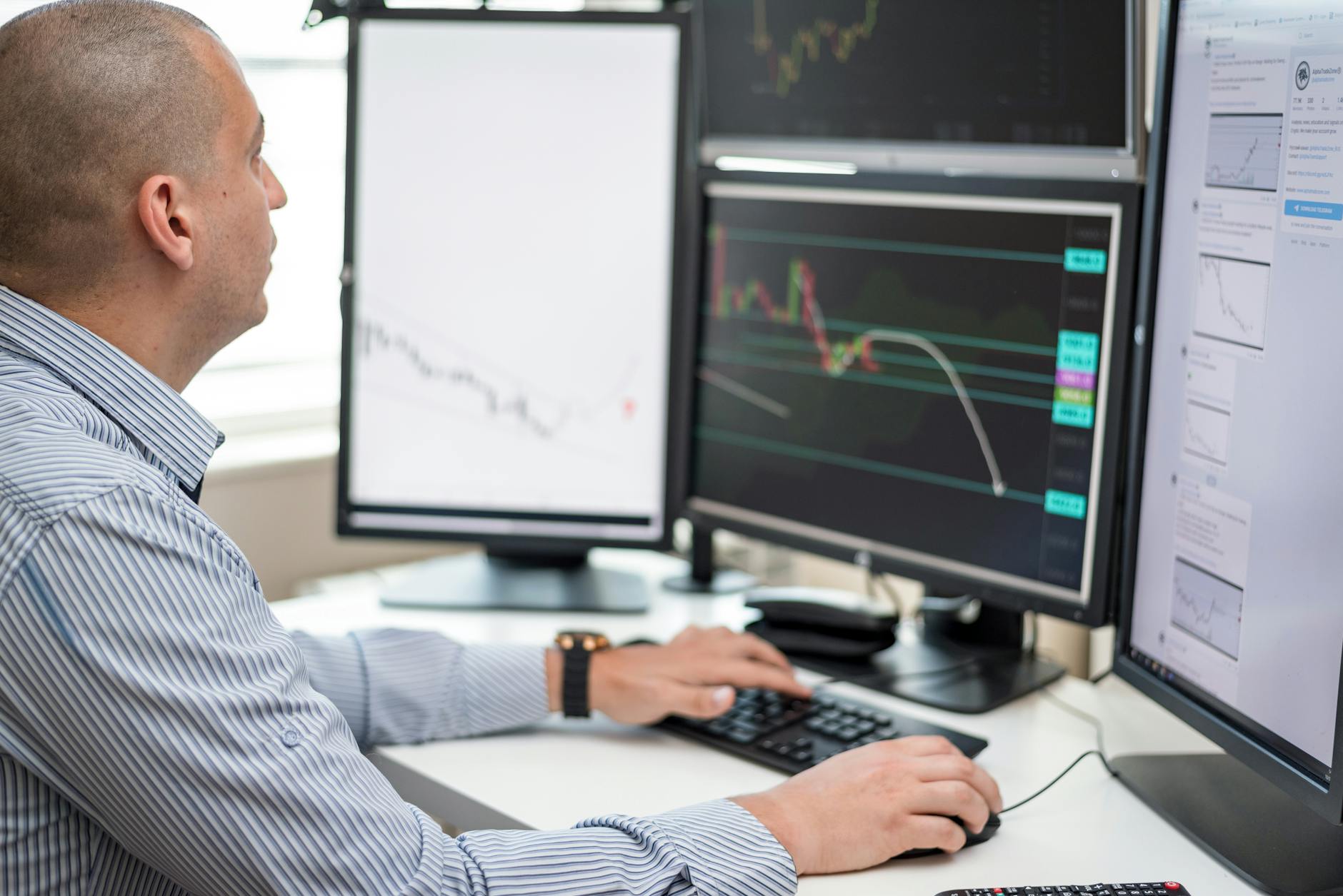 Computer screen displaying financial charts and investment portfolio data