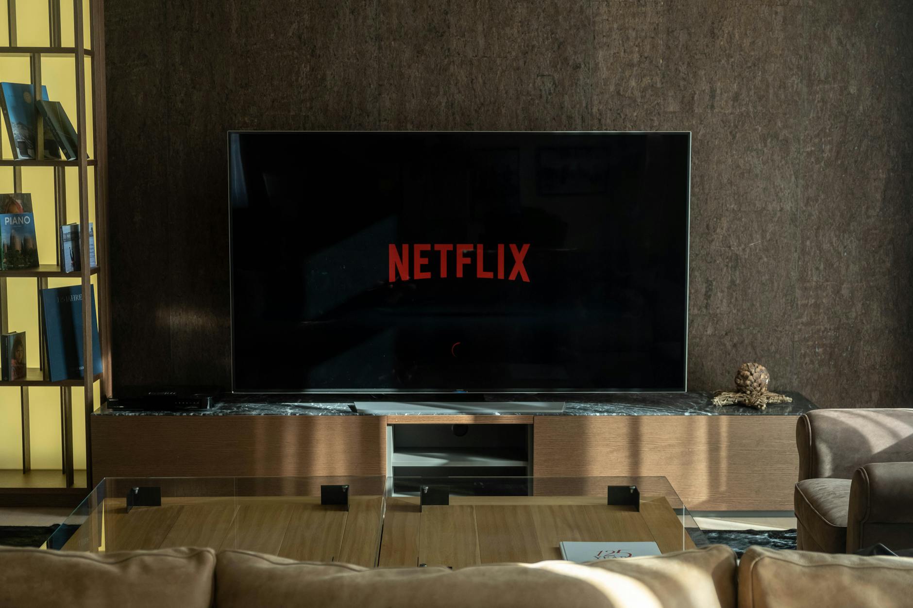 Modern smart TV displaying a streaming service interface with multiple content options on screen