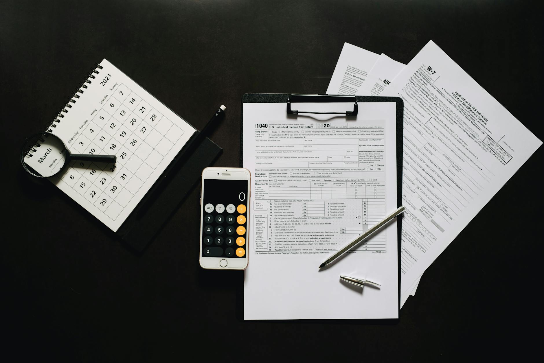 Financial documents and calculator on desk showing investment planning and analysis