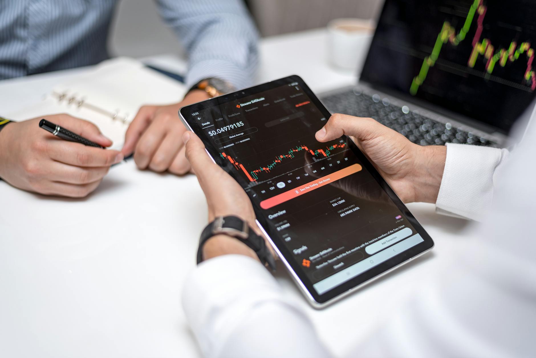 Business analyst reviewing financial performance charts on digital tablet