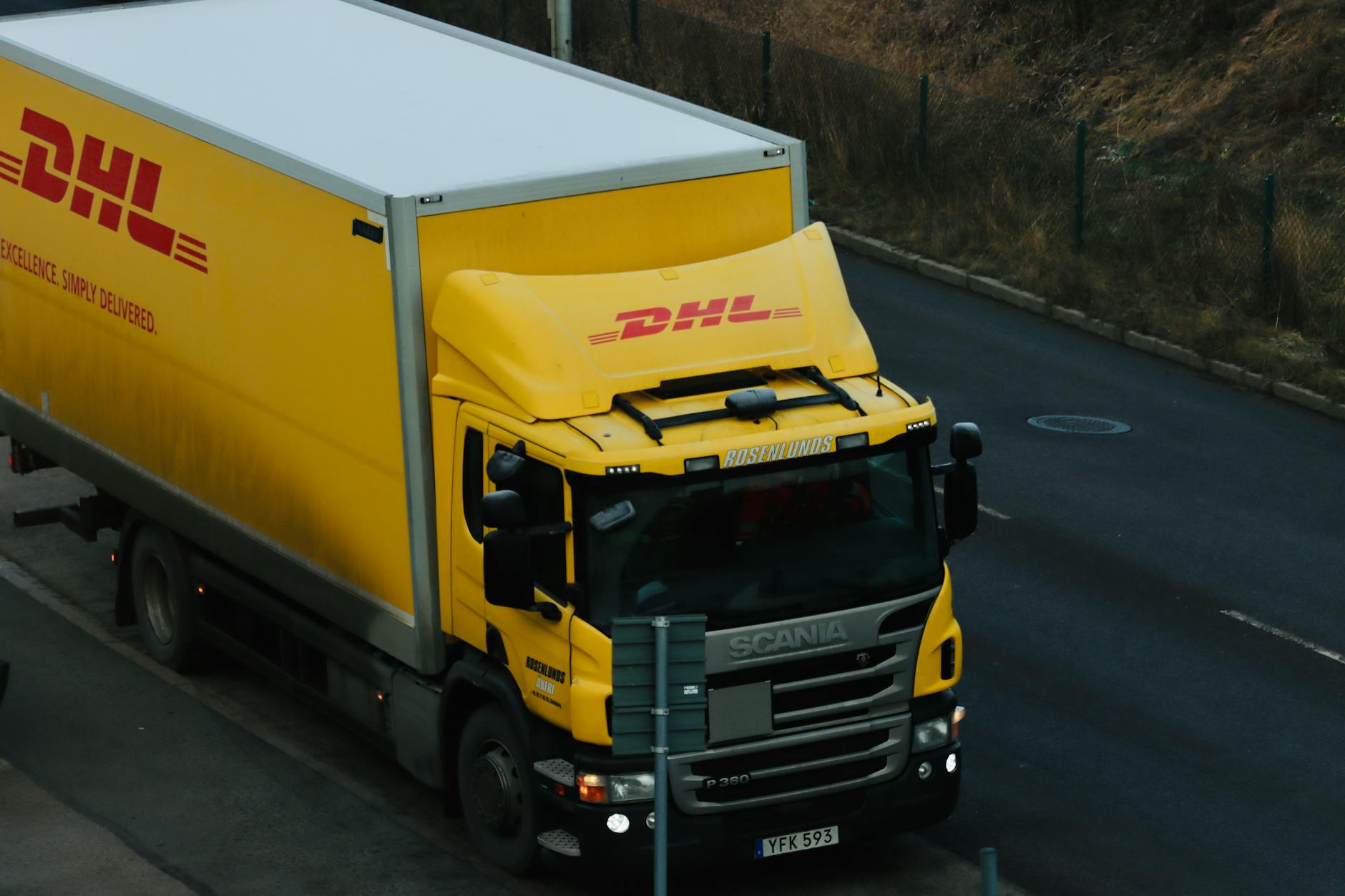 Delivery vehicle on residential street representing last-mile shipping services