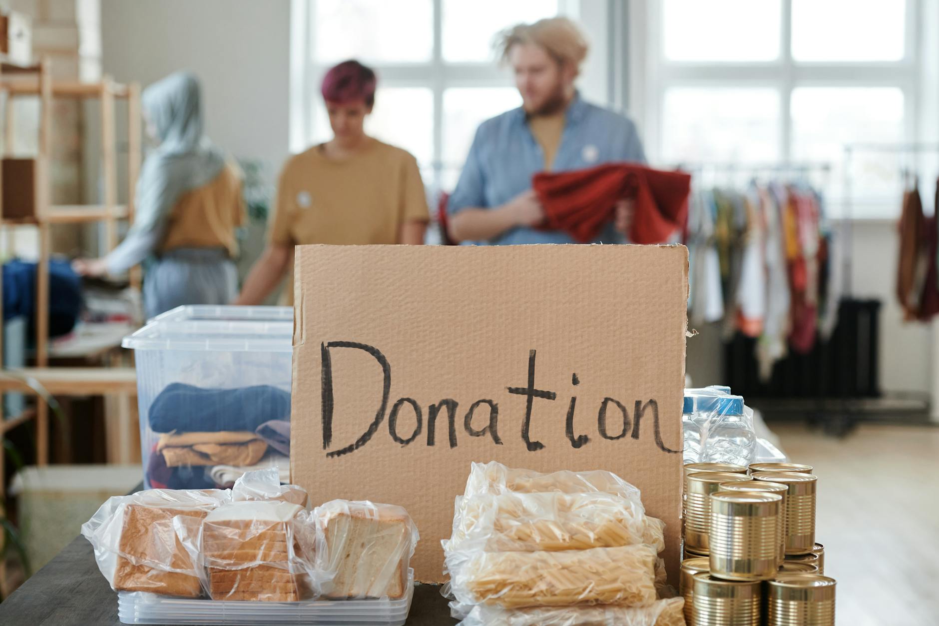 Hands passing donation or charitable contribution symbolizing philanthropic giving