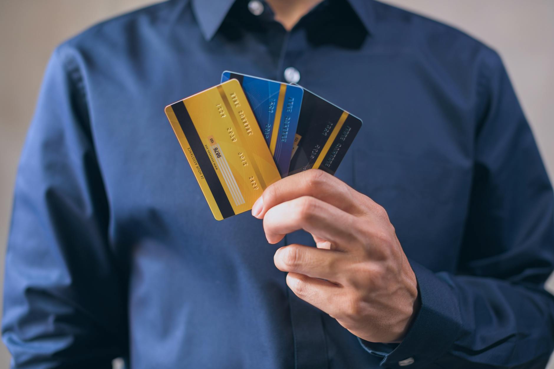 Multiple credit cards arranged on a wooden surface