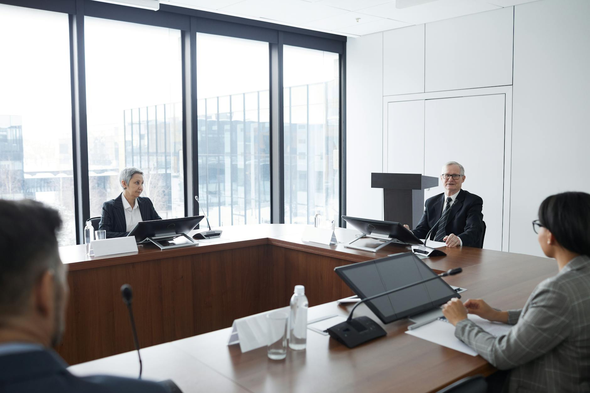 Business professionals in meeting discussing financial projections and climate risk planning