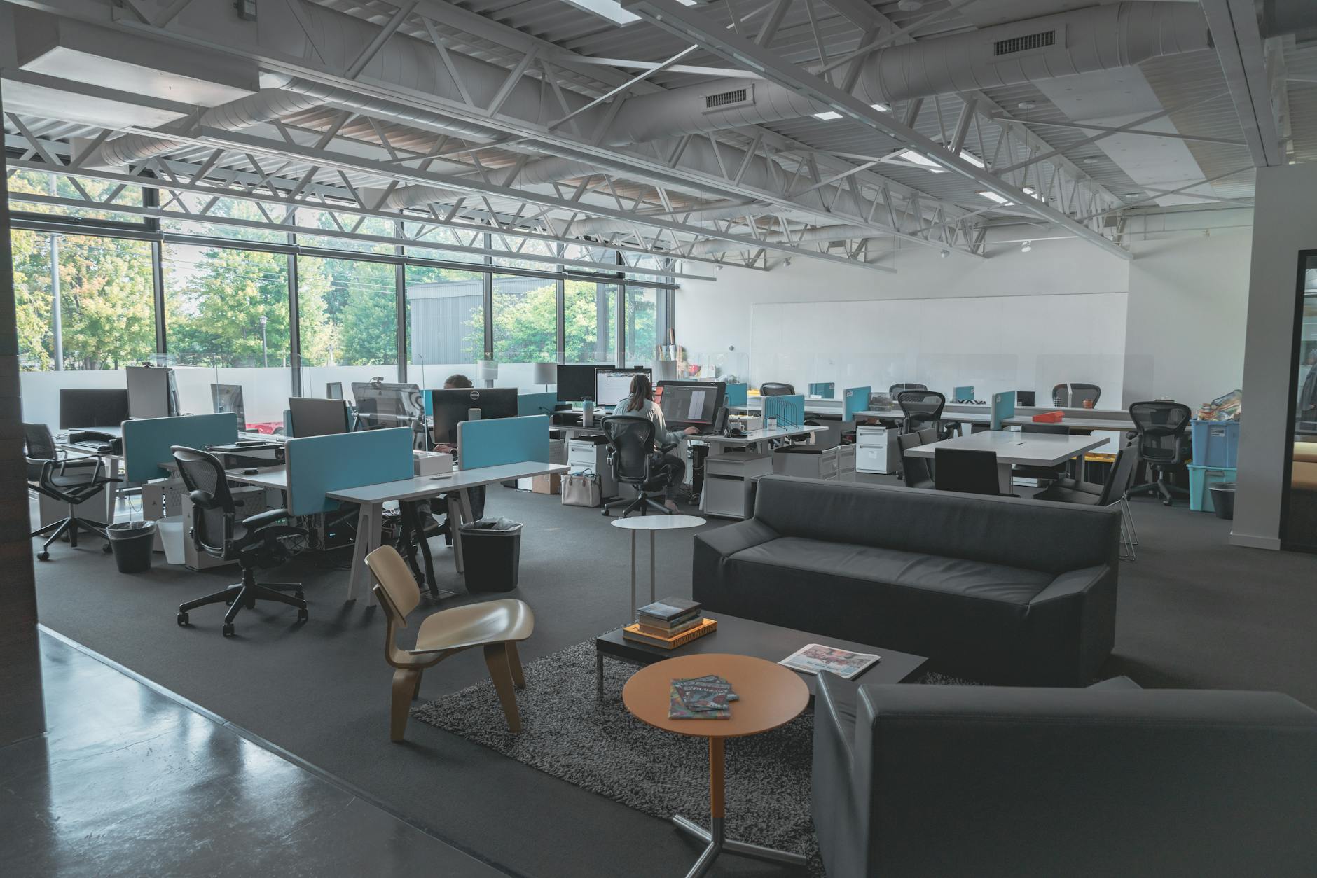 Modern office workspace with digital financial management technology and devices