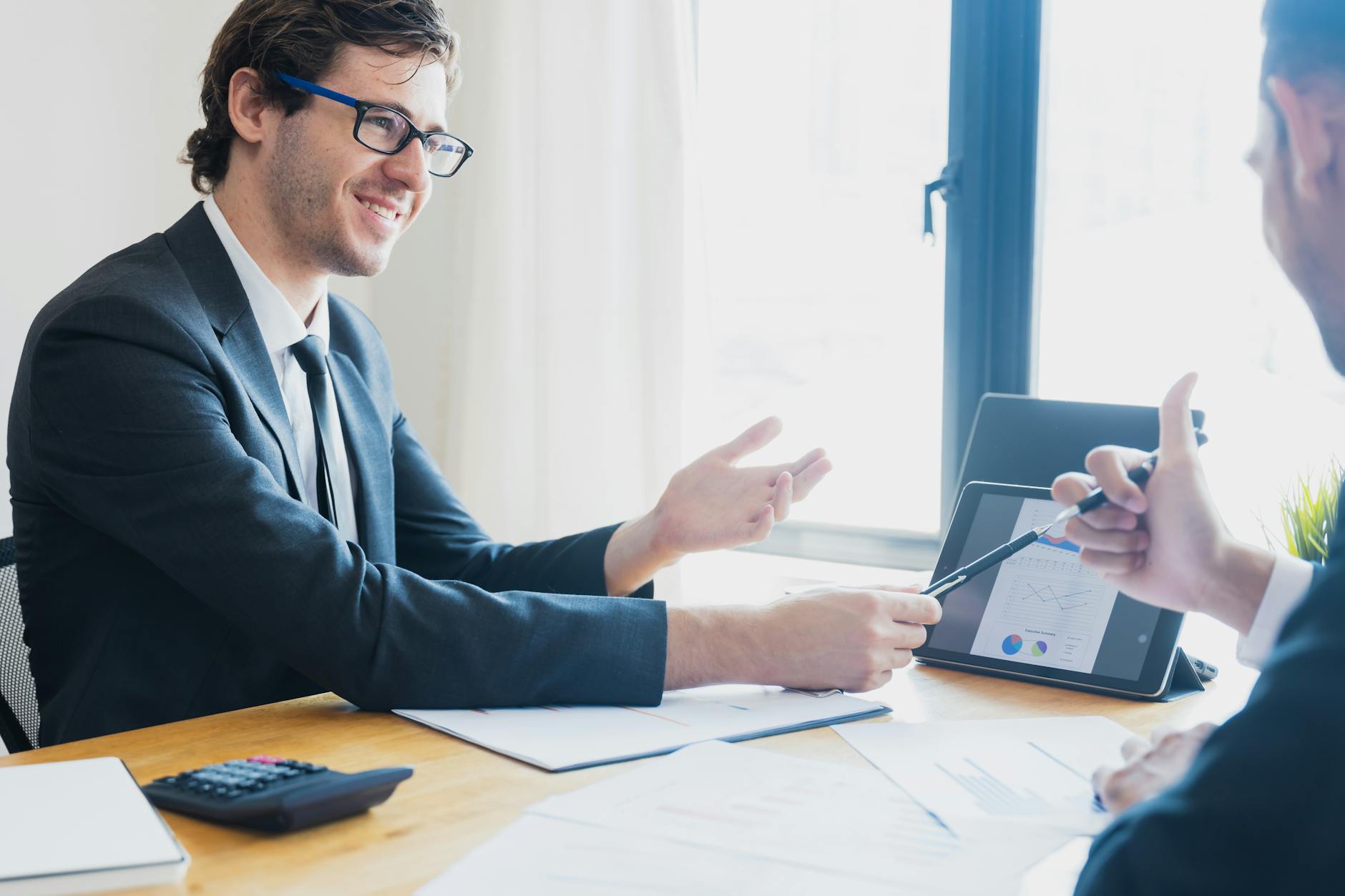 Professional consultation meeting between advisor and client in modern office
