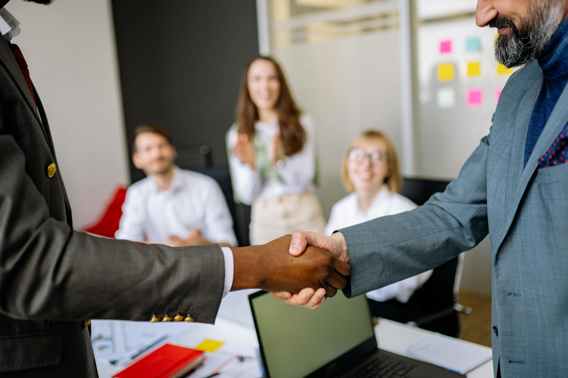 Professional business handshake representing corporate merger and acquisition deal