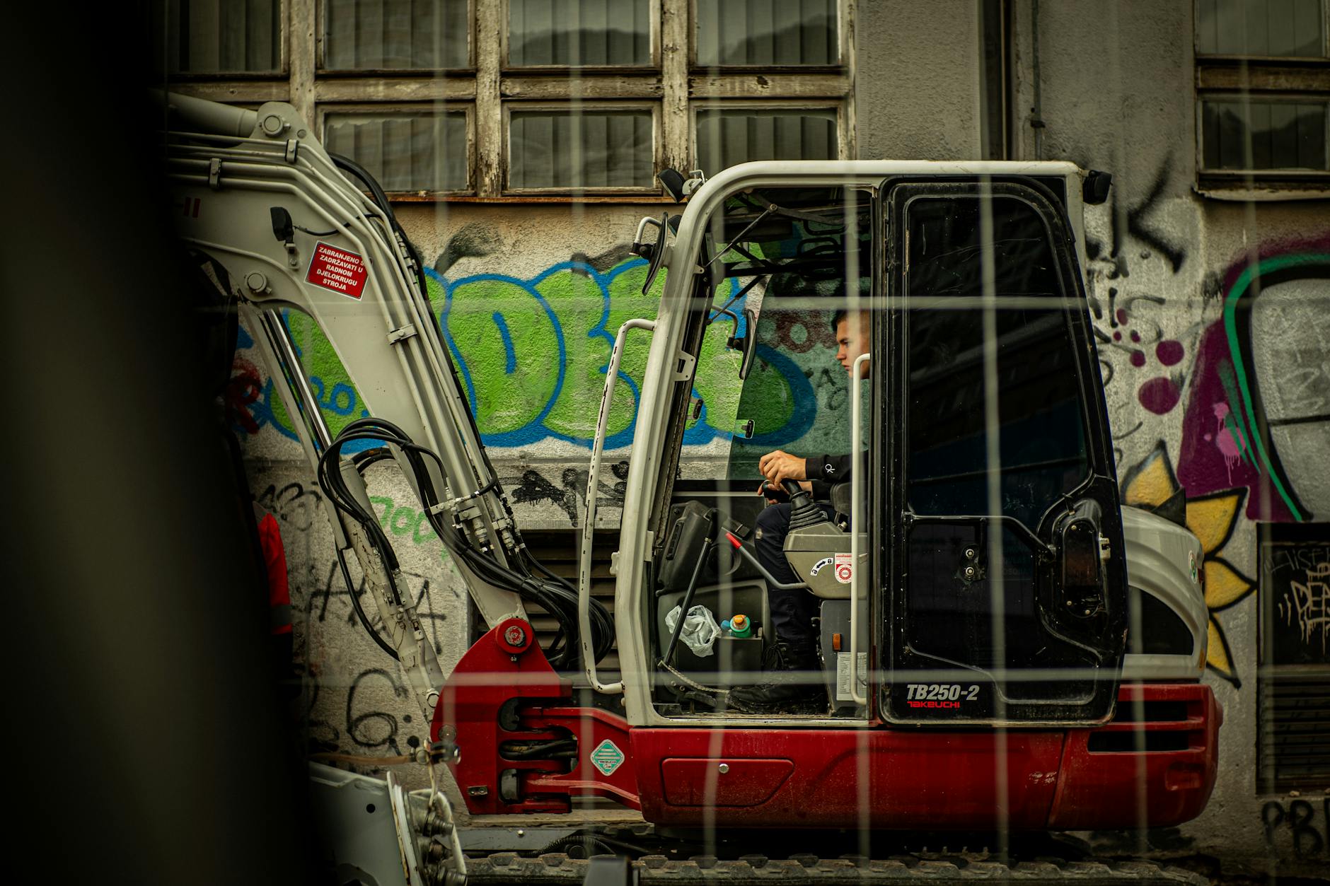Construction worker wearing hard hat and safety vest on job site