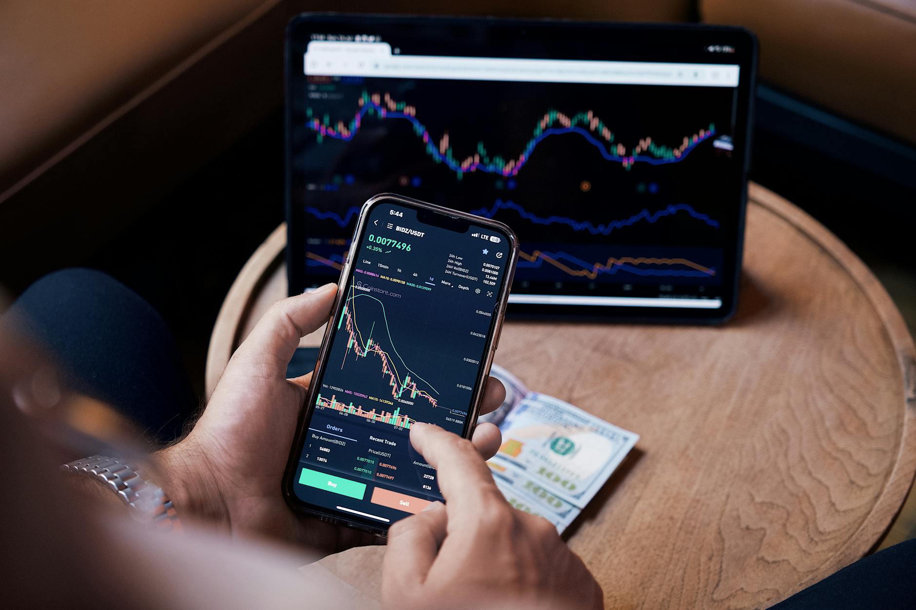 Multiple computer screens displaying stock market data and trading charts