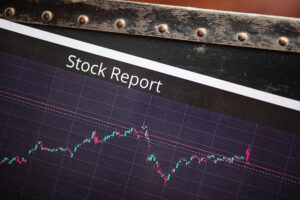 Financial charts and graphs displaying market data on computer screens