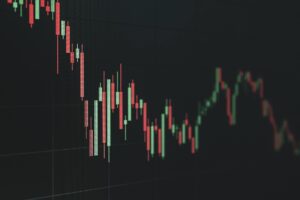 Red stock market chart showing declining prices and downward trend