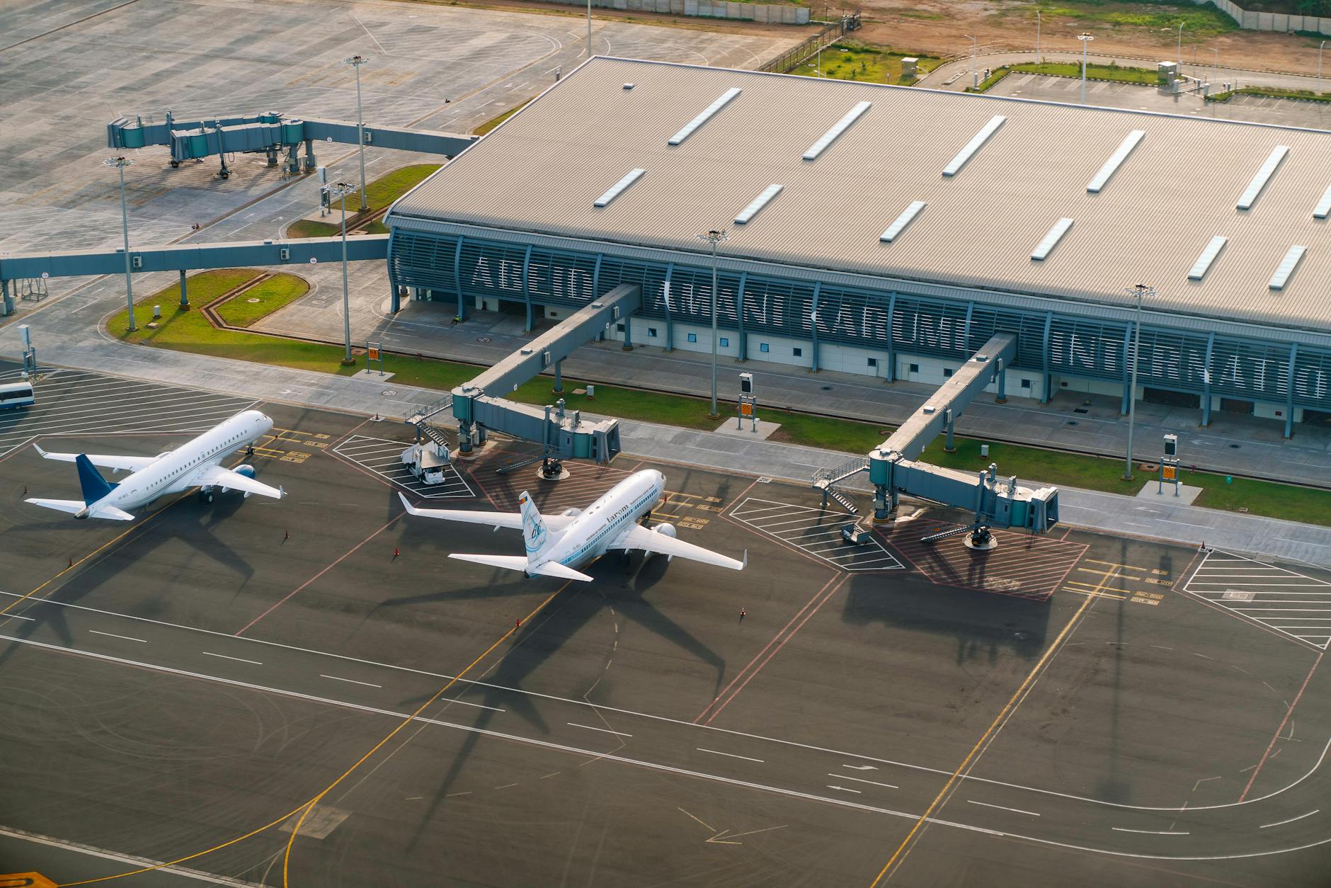 Commercial aircraft at airport terminal gate