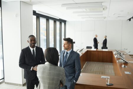 Corporate executives discussing strategy in modern boardroom