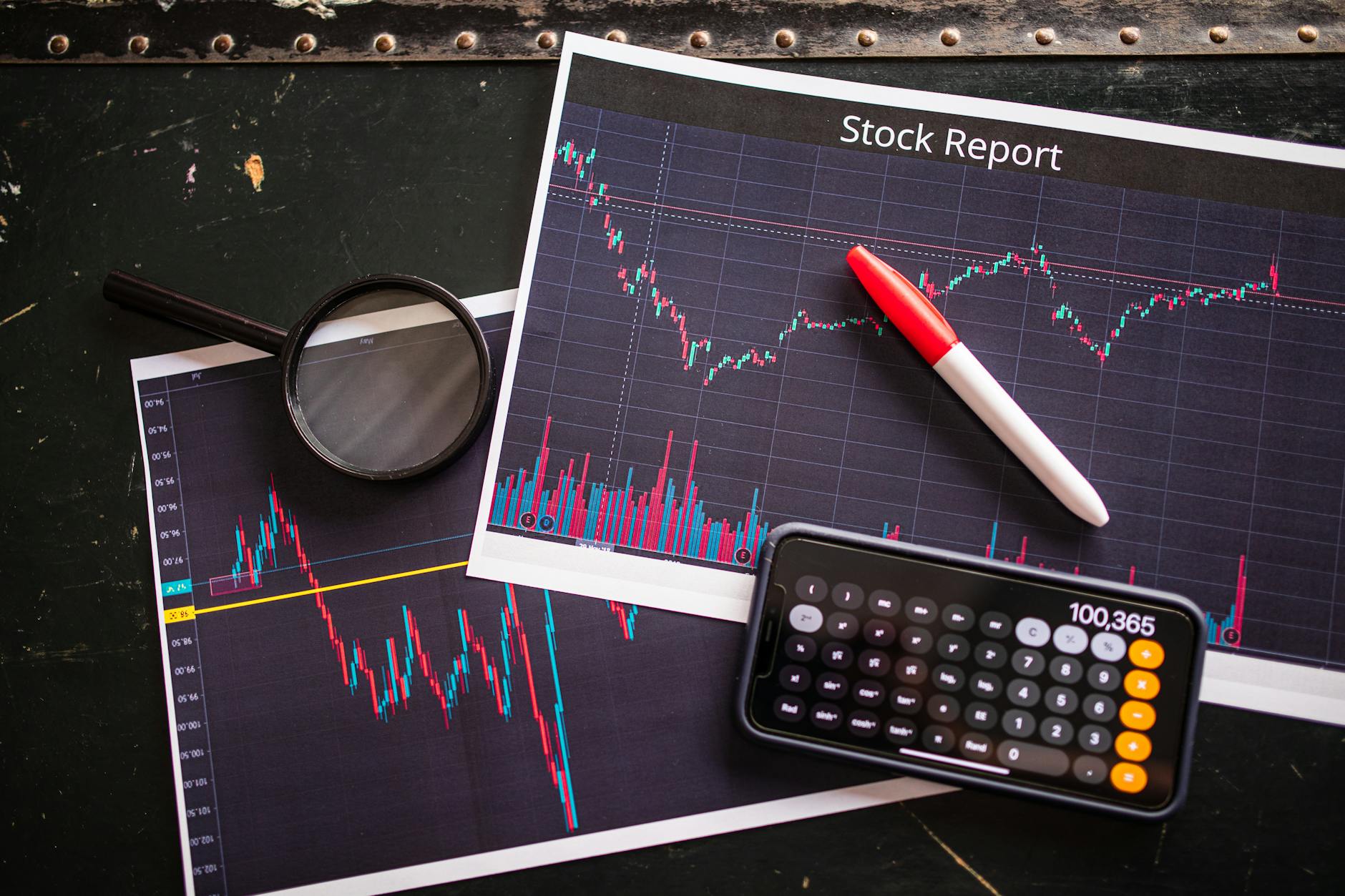 Financial data and stock charts on computer screens