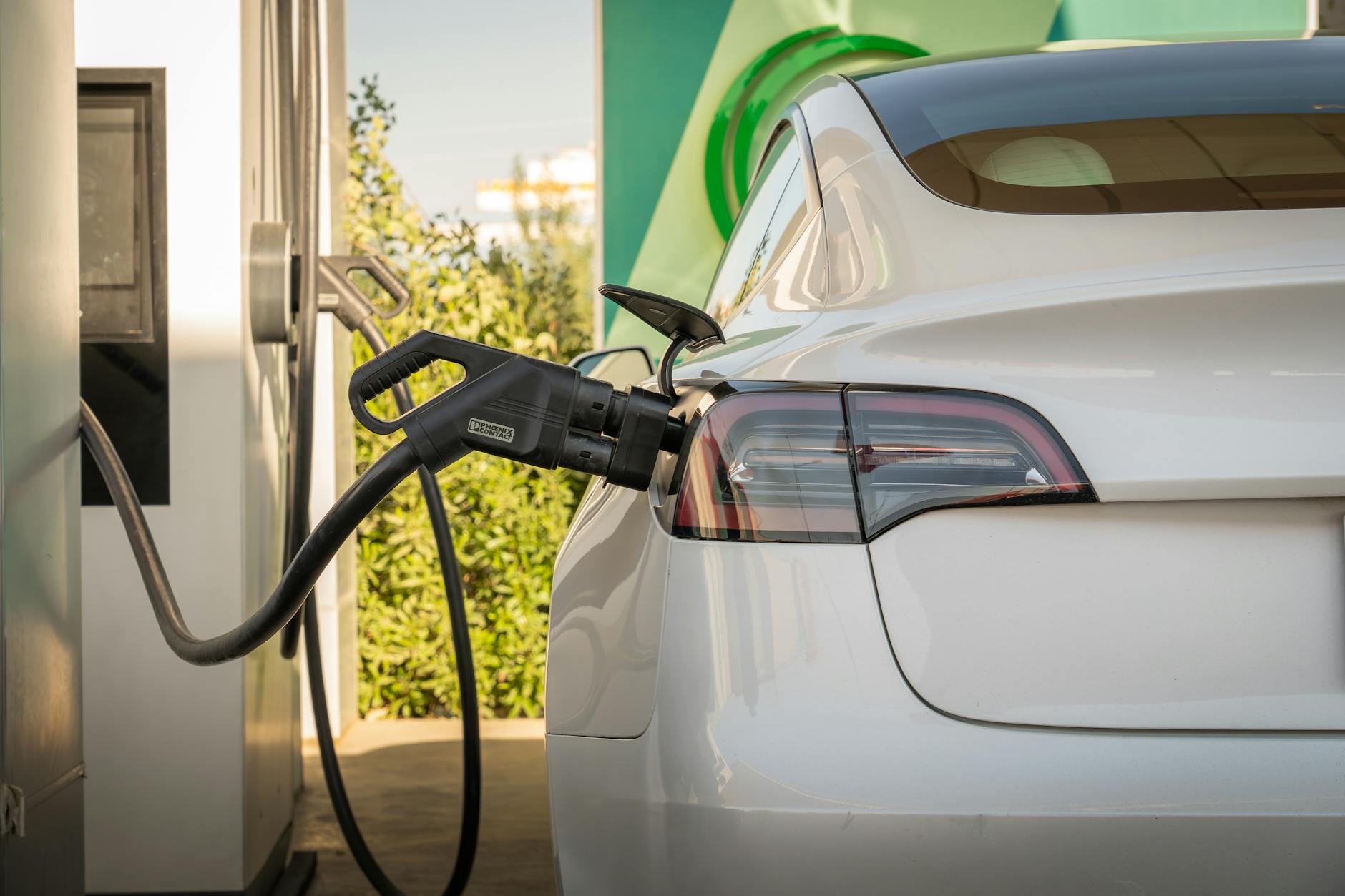 Electric vehicle connected to fast charging station demonstrating rapid charging technology