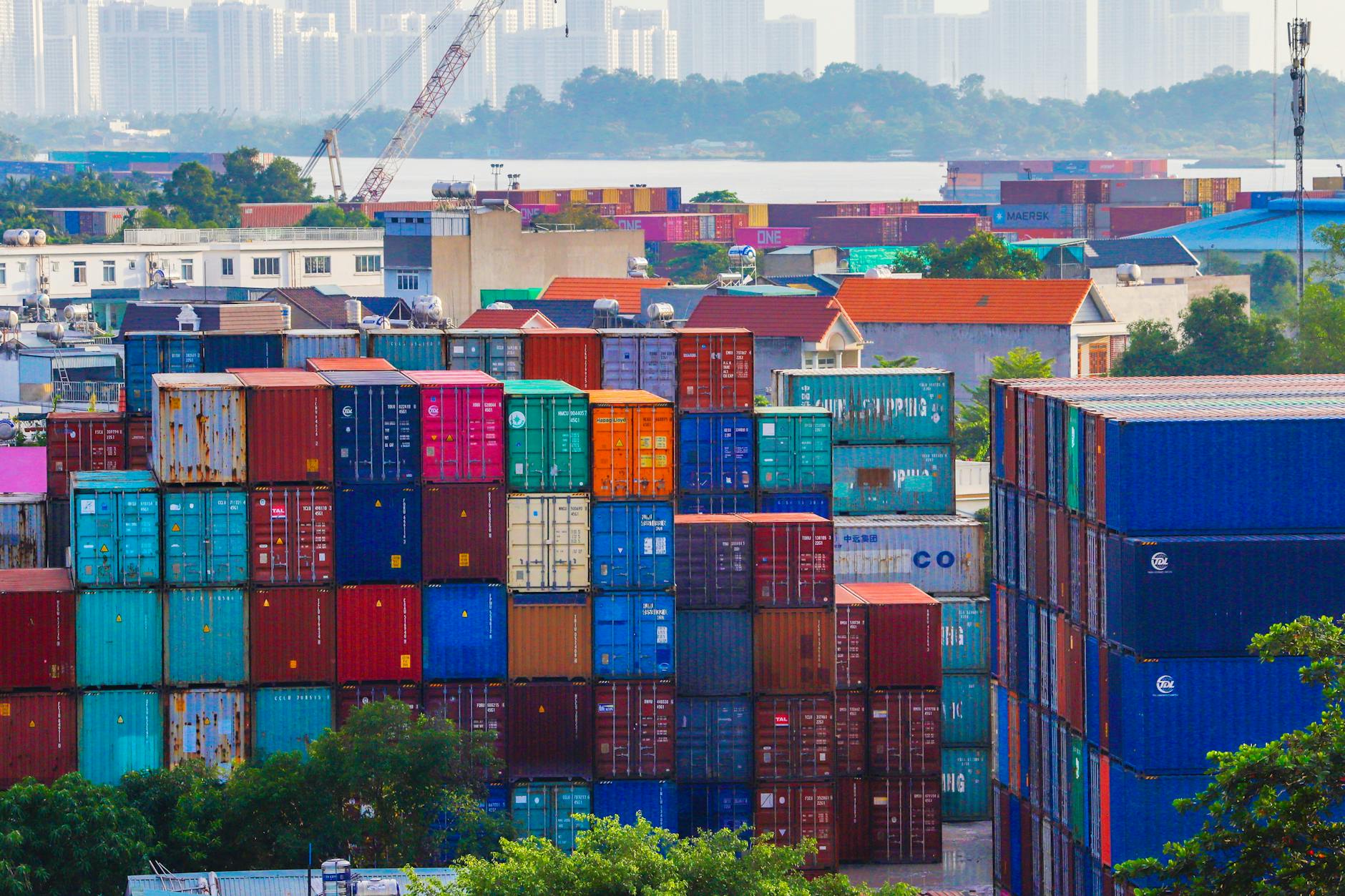 Container ships and cargo handling equipment at busy commercial port