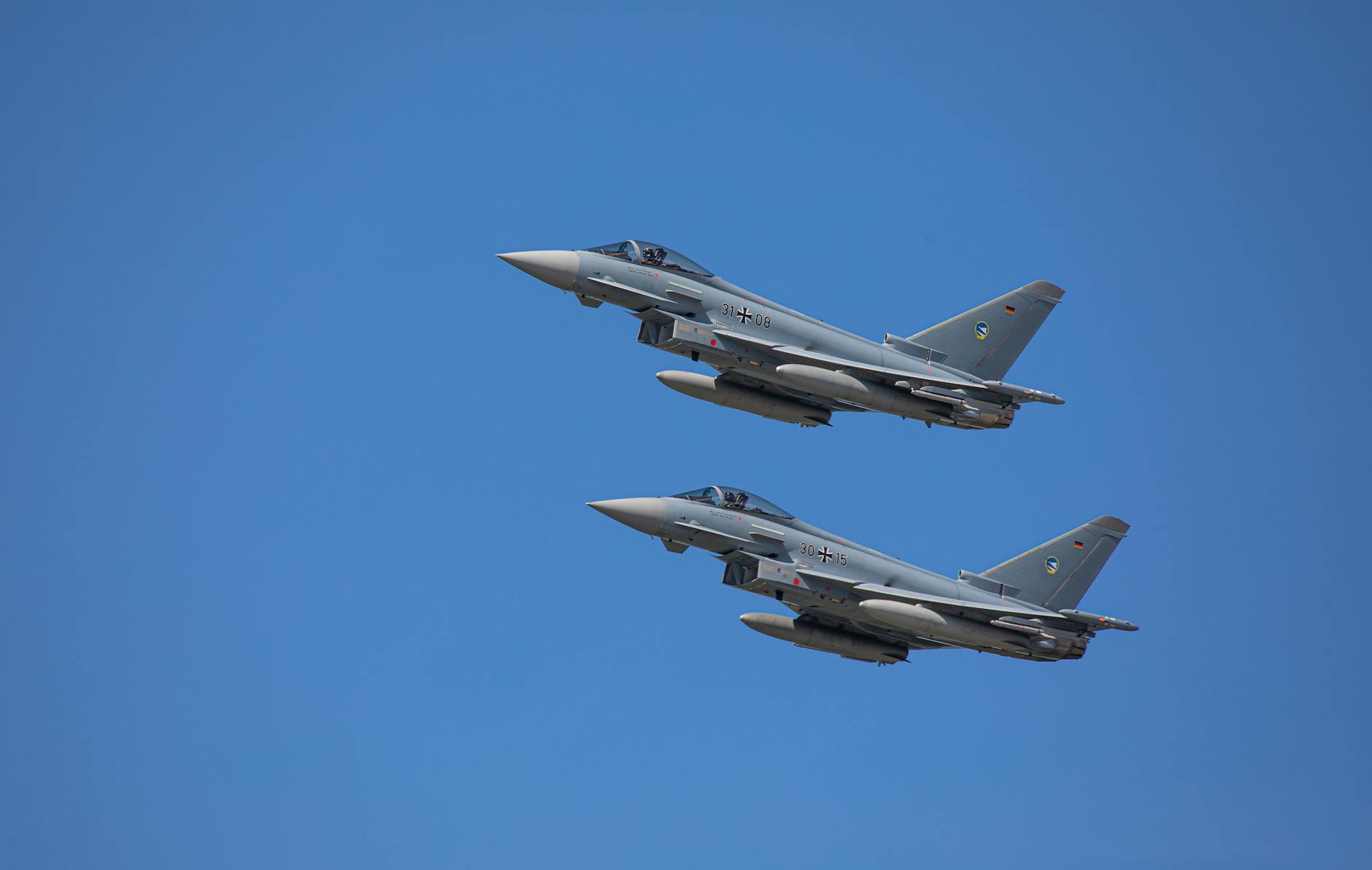 Modern military fighter jets on runway at defense contractor facility