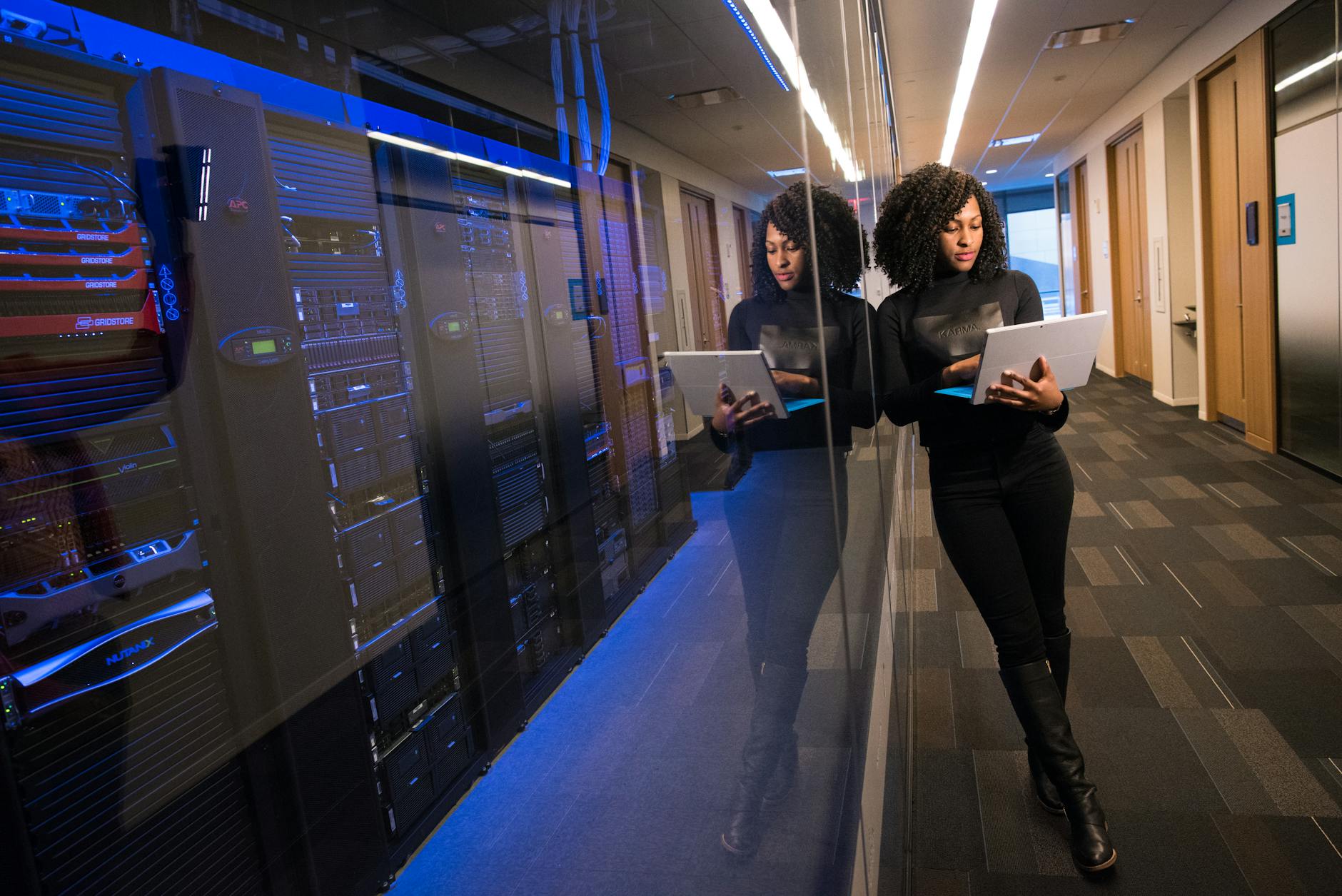Rows of computer servers processing data in modern facility