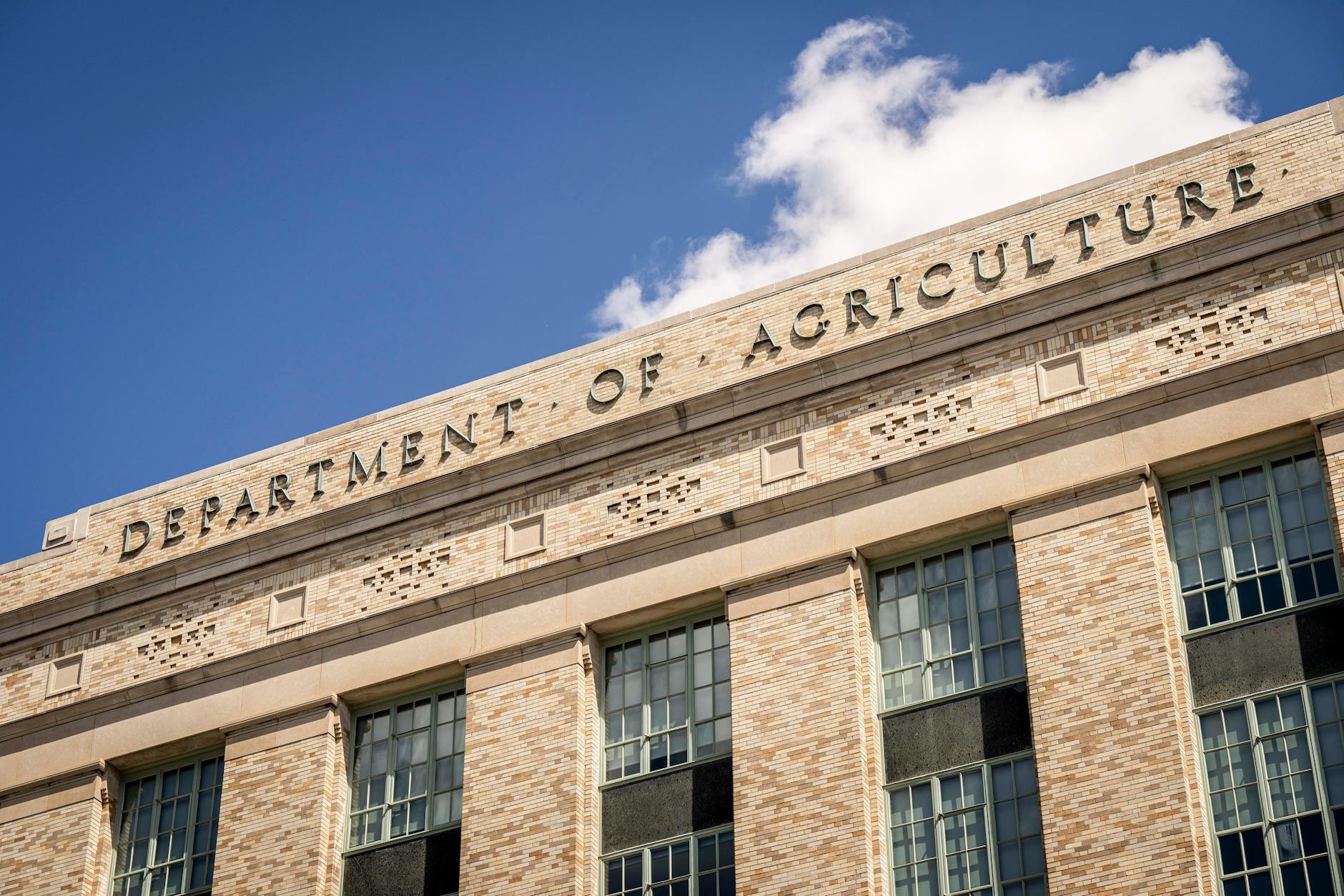Federal government building exterior with American flag