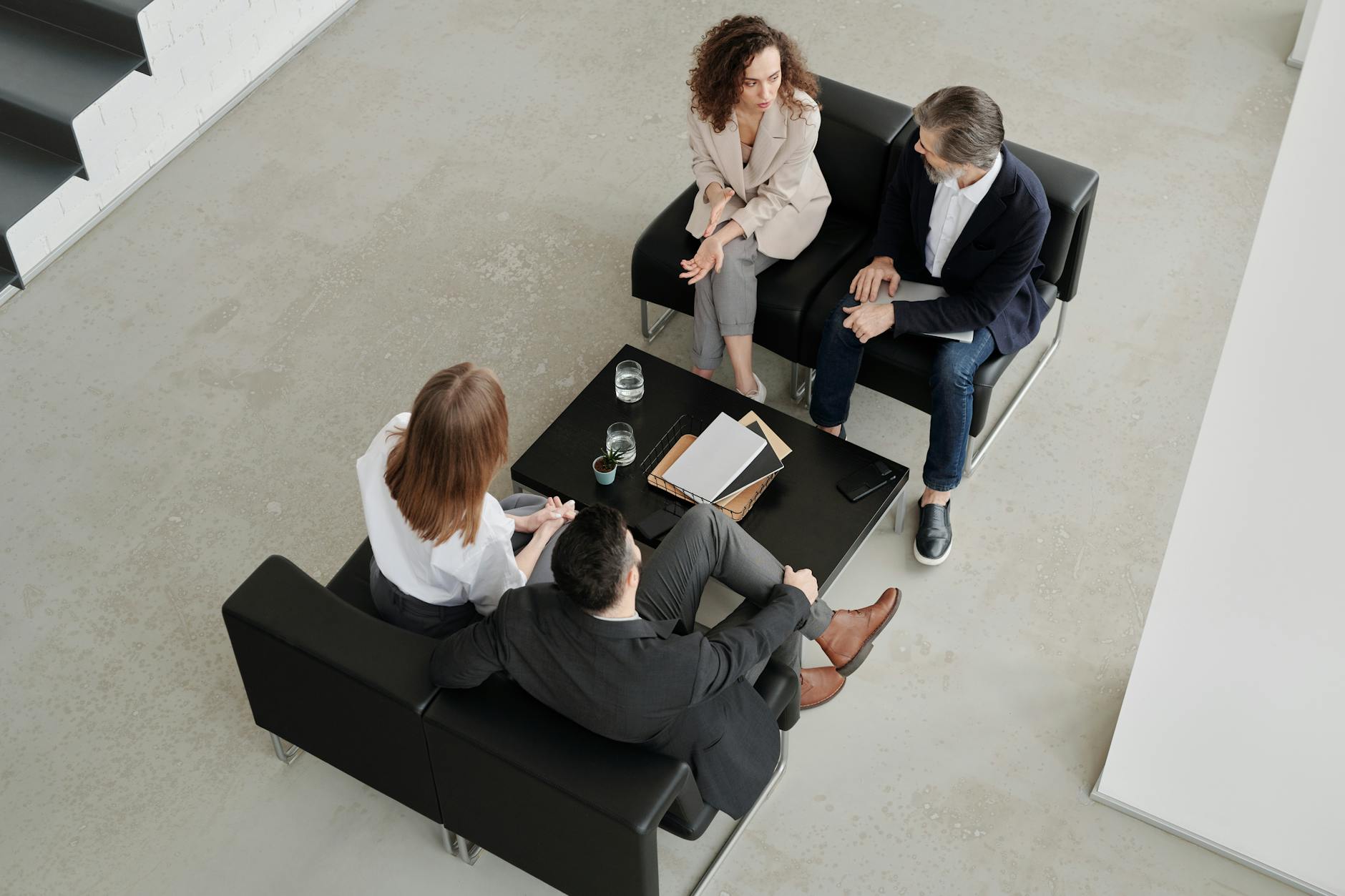 Business professionals discussing investment strategies in office setting