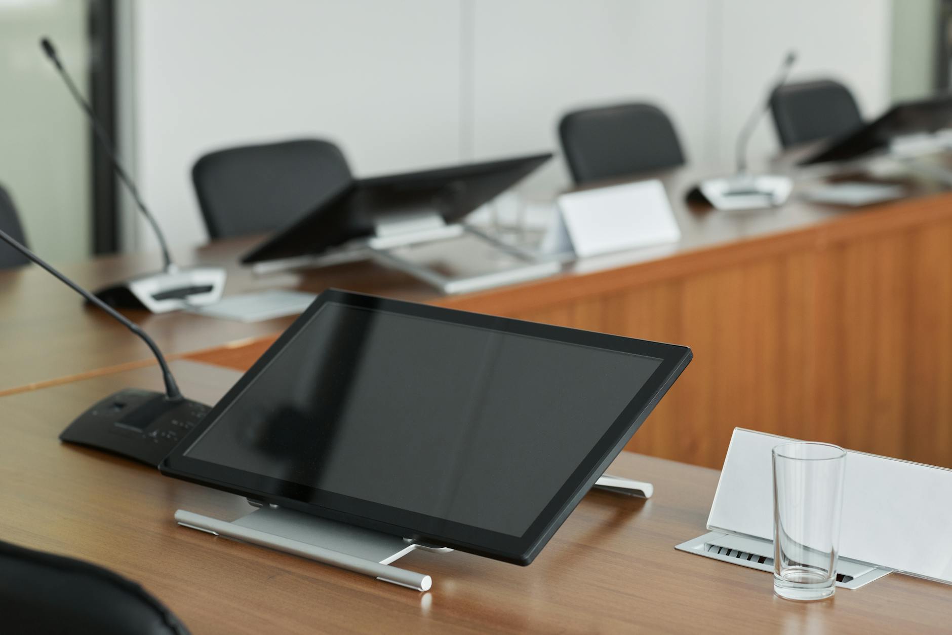 Business professionals discussing technology strategy in modern office setting