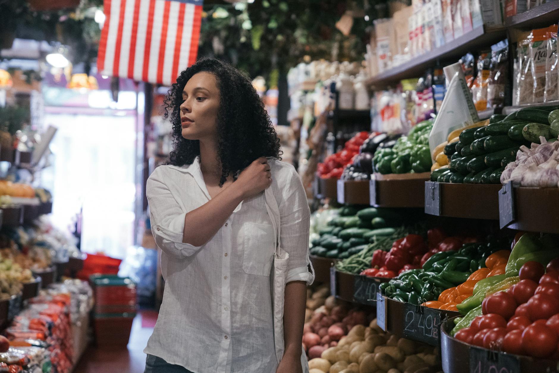 Person shopping for fresh produce in grocery store
