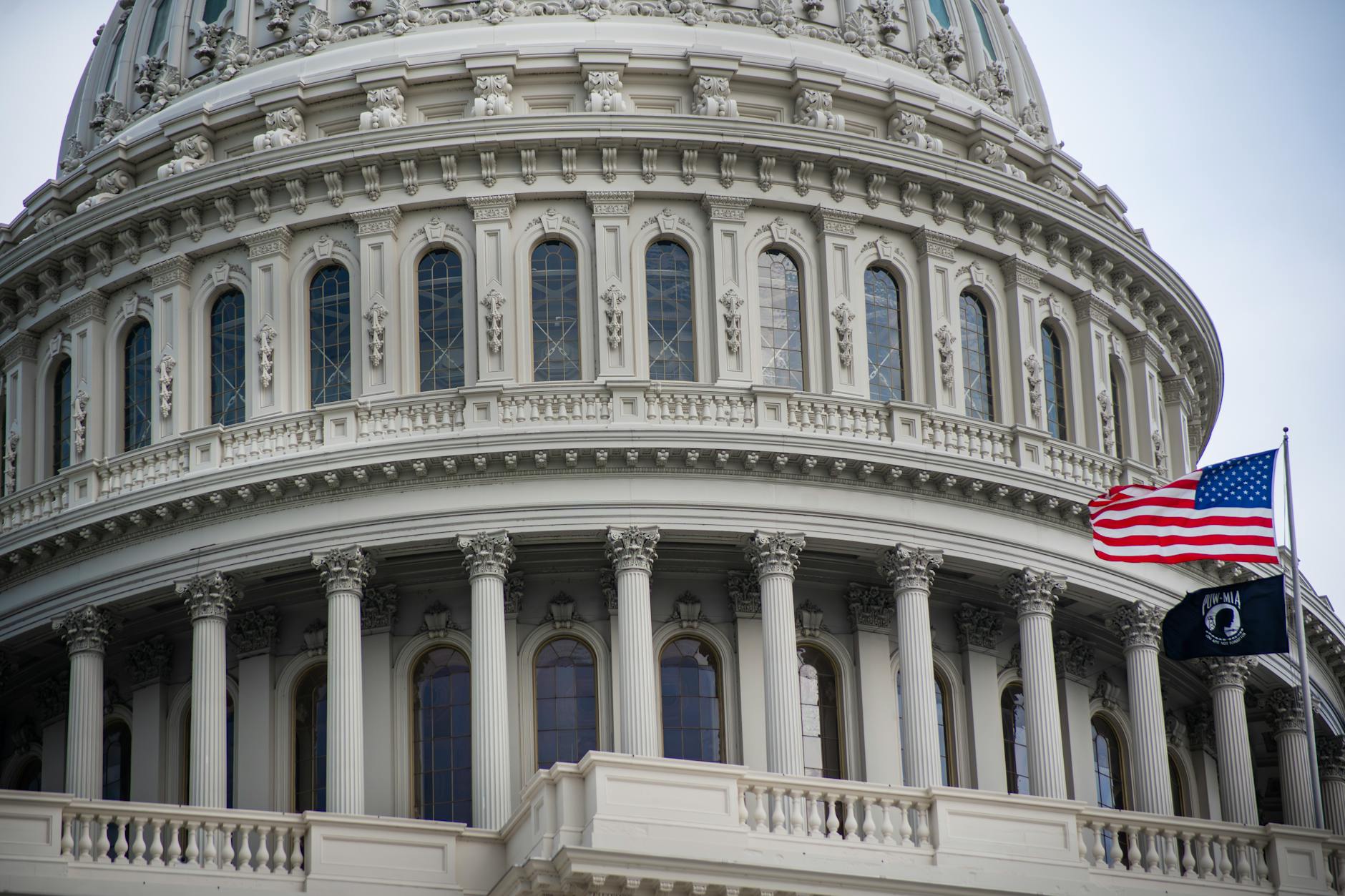 U.S. Capitol building dome against cloudy sky in Washington DC