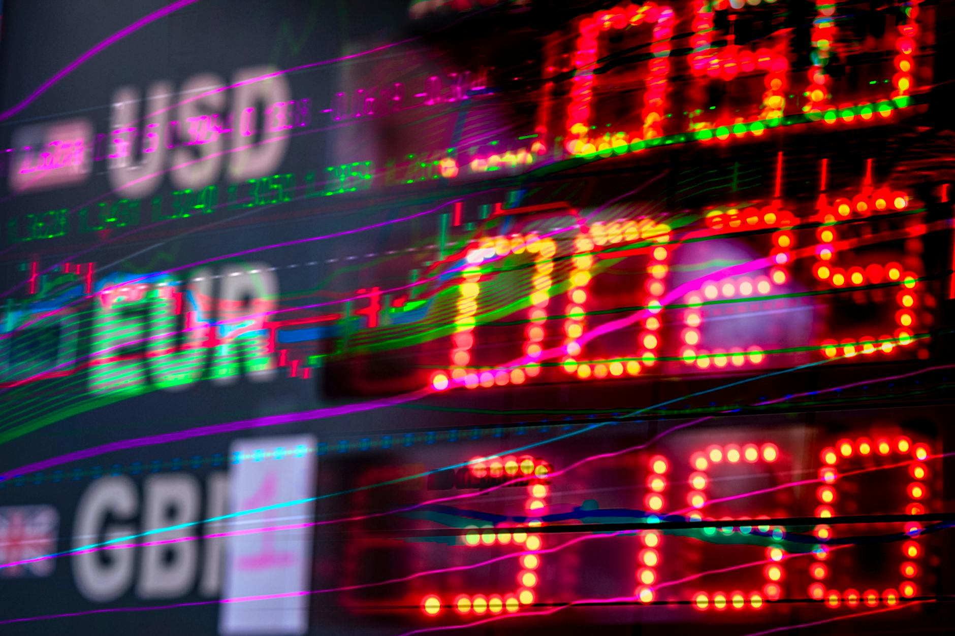 International stock exchange trading floor with financial displays