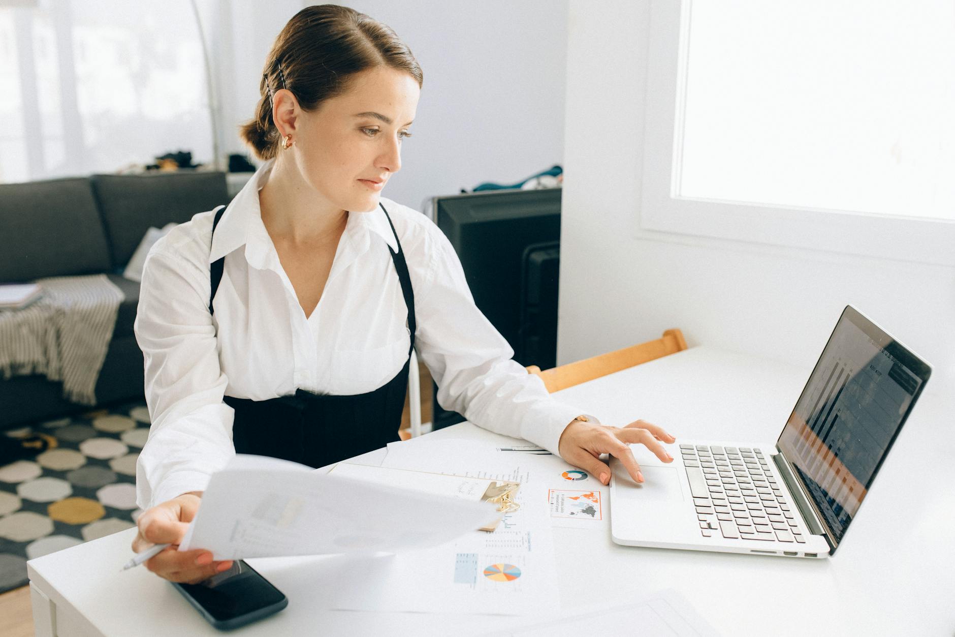 Professional analyst reviewing financial data and market projections on computer screens