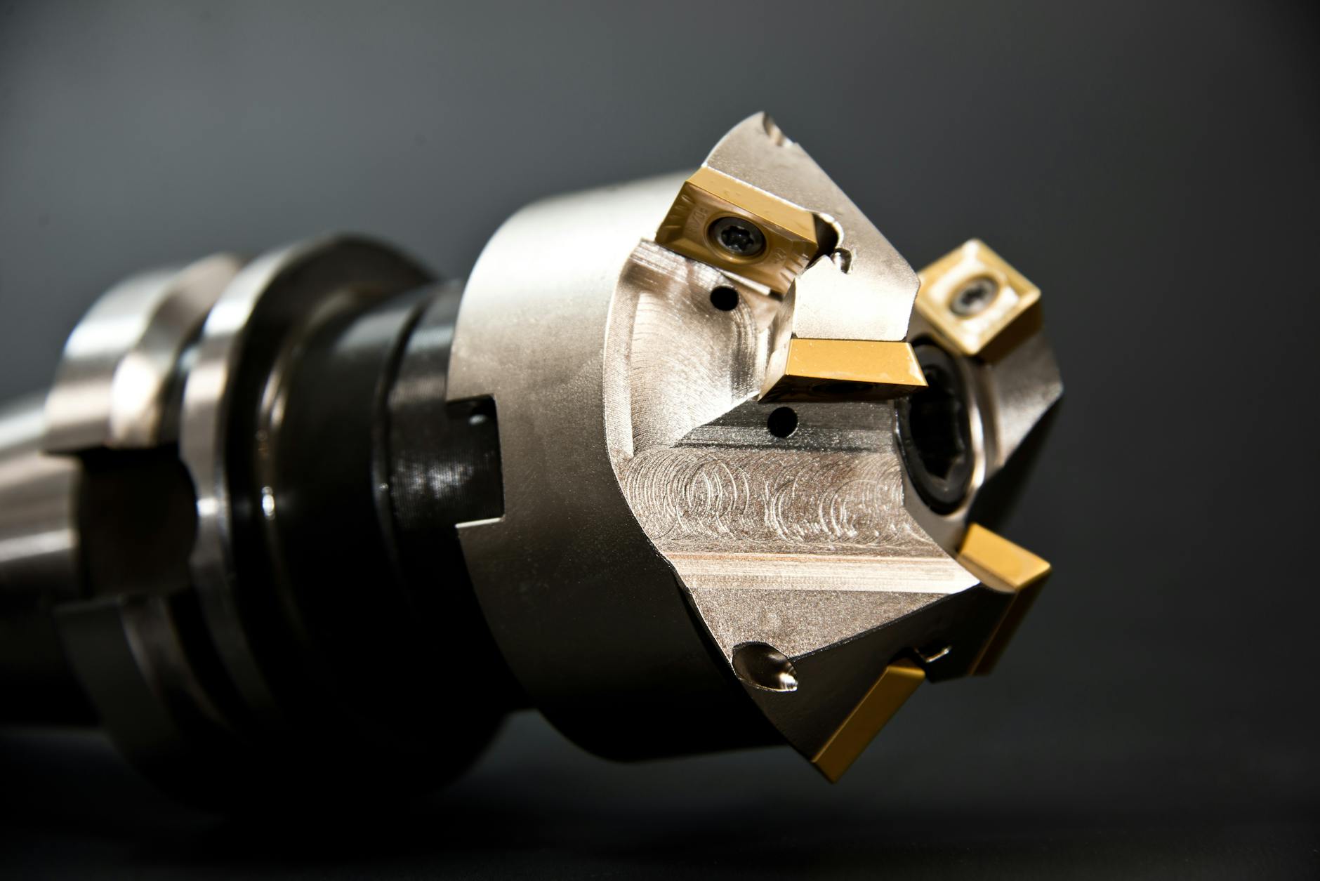 Workers assembling precision optical equipment in clean manufacturing facility