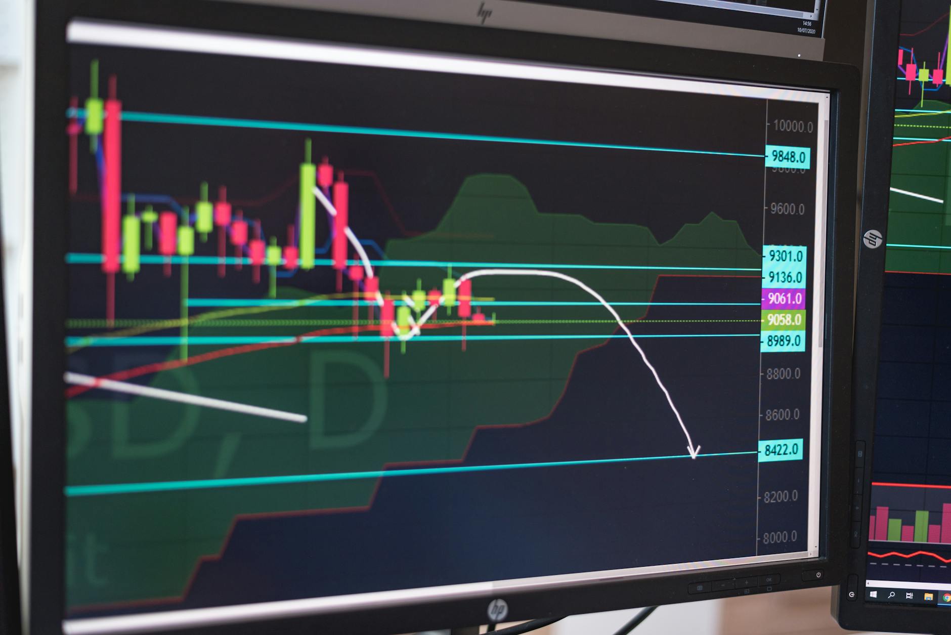 Busy stock trading floor with multiple monitors and traders working