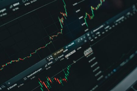Financial data and stock market charts displayed on computer screens
