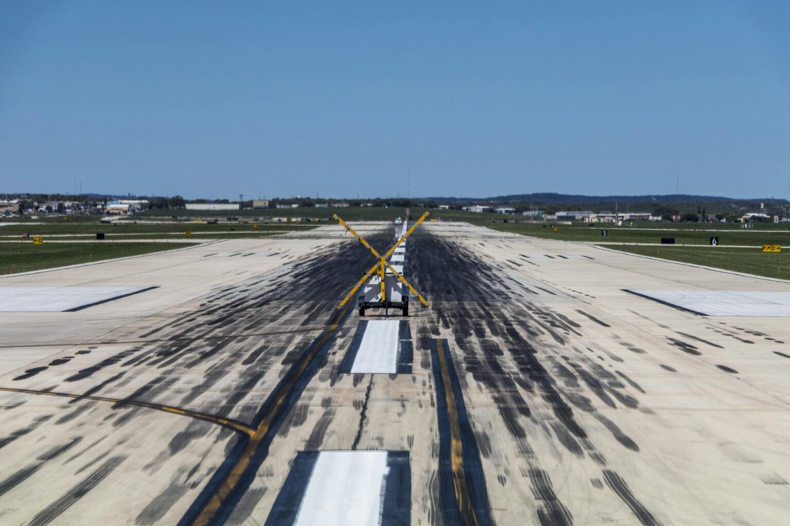 Commercial aircraft on airport runway during landing approach