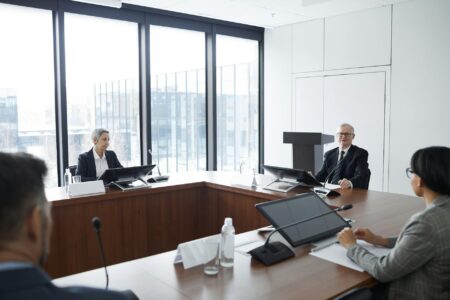 Business professionals in a corporate meeting room discussing strategy