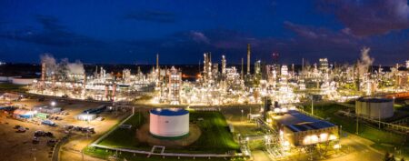 Industrial oil refinery with storage tanks and processing equipment