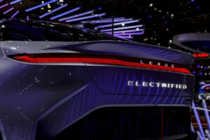 A sleek electric luxury performance car on an empty road