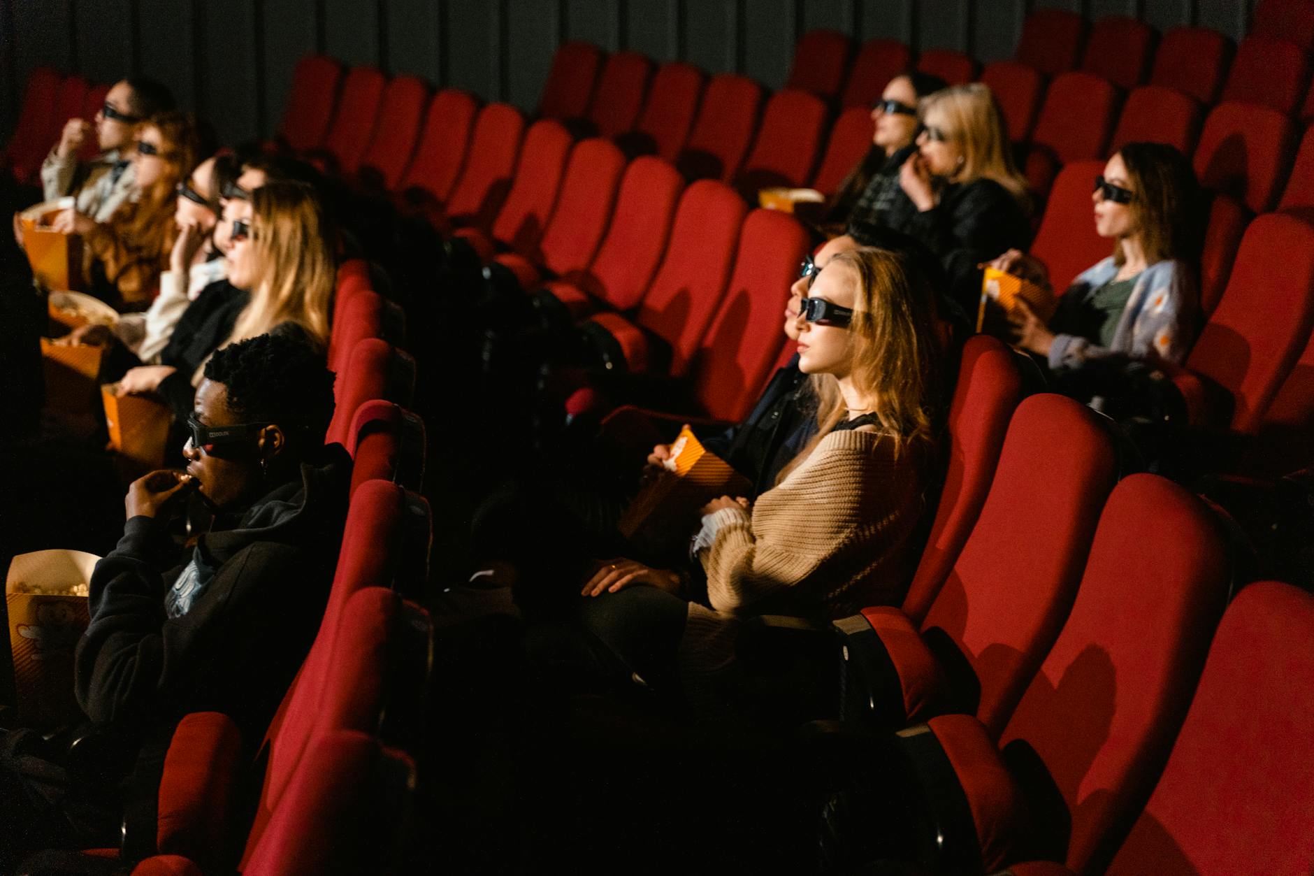 Movie theater audience watching independent film screening
